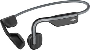 SHOKZ OpenMove grey bone conduction wireless headphones with open-ear design, lightweight frame, and Bluetooth connectivity for running and cycling.