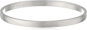 Kate Spade Idiom Bangle Bracelet UK in silver plated metal featuring the engraved quote “Find the silver lining”
