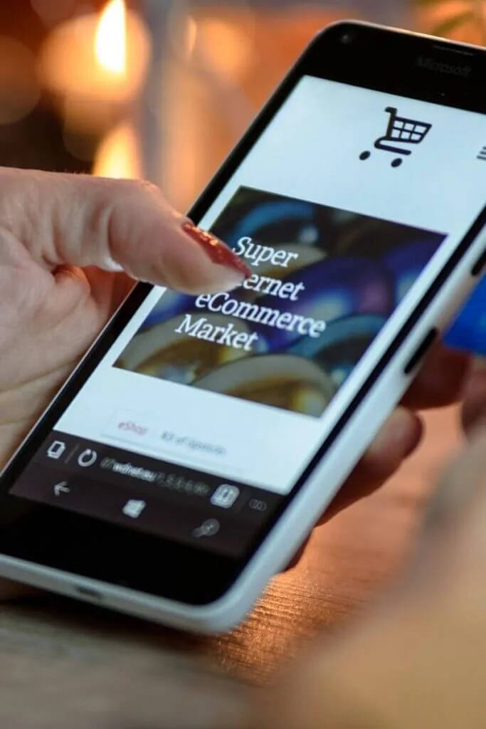 Shop online easily with best deals UK - woman using smartphone for Amazon UK shopping